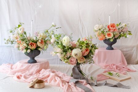Still life with  beautiful bouquets of flowers and candlesの写真素材