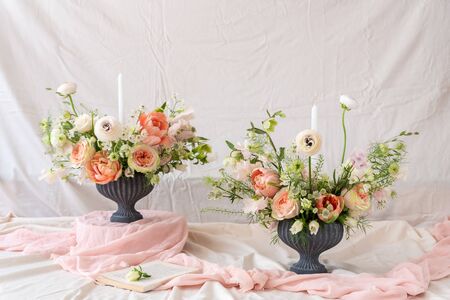 Still life with  beautiful bouquets of flowers and candlesの写真素材