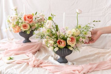 Still life with  beautiful bouquets of flowers and candlesの写真素材