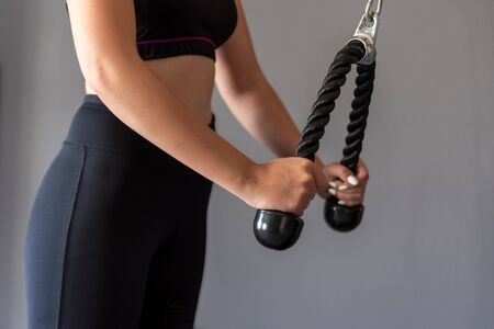 Young athletic woman exercising at the gym.の写真素材