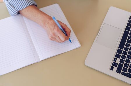 Middle age senior woman hands working on modern laptop at home
