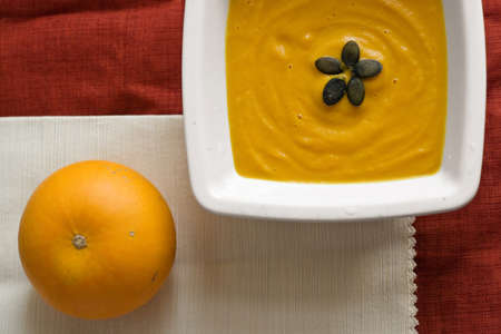 pumpkin soup in white plateの写真素材