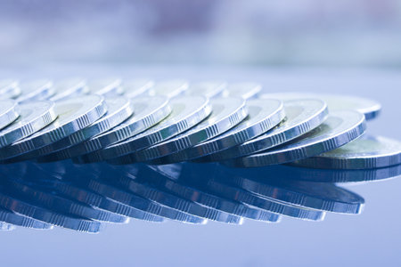 Close up of Thai Baht coins money arrange recline on table with mirror reflection in blue tone.の素材 [FY310185423929]