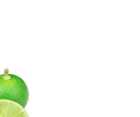 green lime with green leaves isolated on white backgroundの写真素材