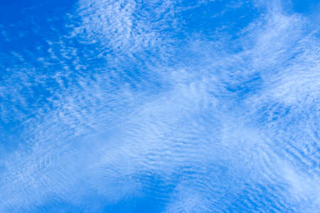 Fantastic soft white clouds against blue skyの写真素材