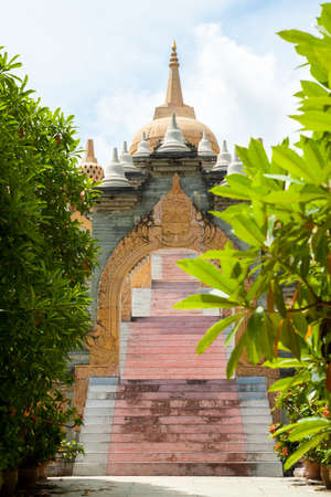 Stone archway and stairs leading into Pagoda in Thailand