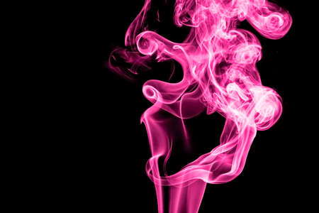 Studio shot of Smoke image on black background and change the color of smoke by a computer program.の写真素材