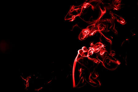 red smoke with light on back backgroundの写真素材