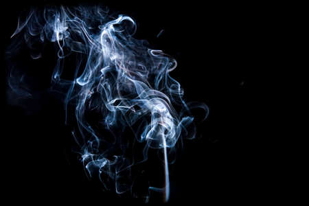 Gray smoke with light on back backgroundの写真素材