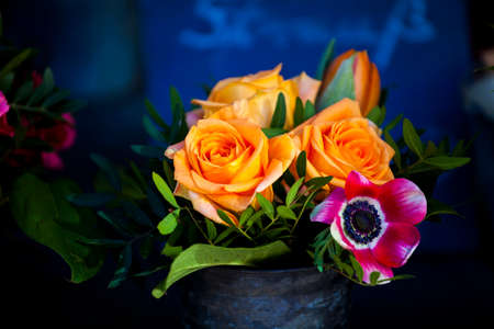 Fresh and beautiful bouquet of golden roses in a vase.の写真素材