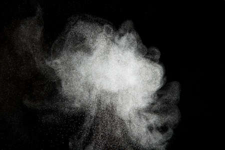 Abstract design of powder cloud against dark backgroundの写真素材