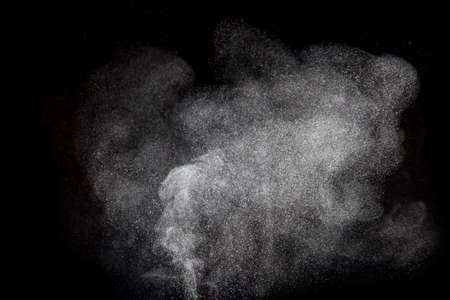 Abstract design of powder cloud against dark background