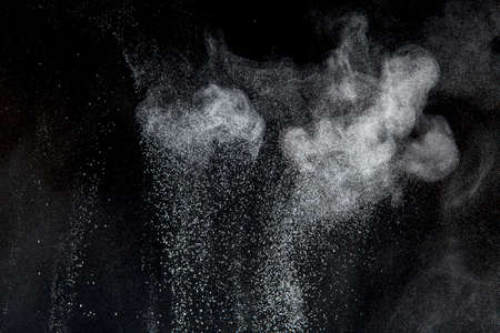 Abstract design of powder cloud against dark backgroundの写真素材