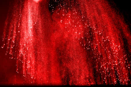 Abstract design of powder cloud against dark backgroundの写真素材