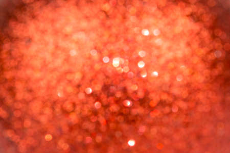 Christmas Background. Red Holiday glowing Abstract Glitter Defocused Background With Blinking Stars....