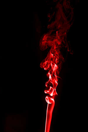 Red smoke on a black background. Shot in studioの写真素材