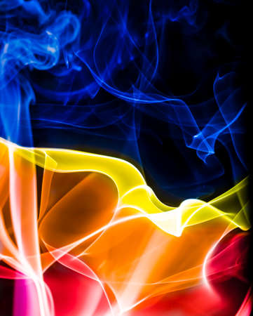 Abstract Colourful Smoke on a black background.の写真素材