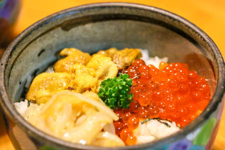 Japanese food under the yellow light in a Japanese restaurant.の写真素材