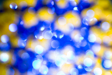 Blue bokeh texture. Festive glitter background with defocused lights.の写真素材