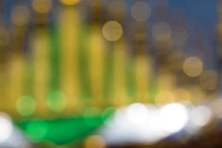 Sparkling Lights Festive background with texture. Abstract Christmas twinkled bright background with bokeh defocused silver and golden lightsの写真素材