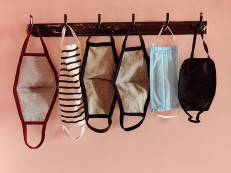 Face masks isolated in pink background. Indoorsの写真素材