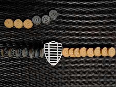 Top view Of Shield Security Icon Stopping black coins from falling. As white coins already...