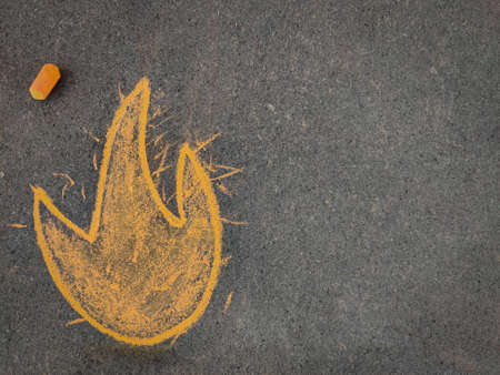Hand drawn fire emoji. Using color chalk pieceの写真素材