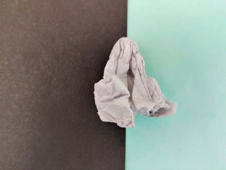 Crushed tissue paper isolated on green and black backgroundの写真素材