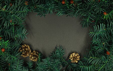 Creative layout made from Christmas tree branches with red berries and frame paper card note. Copy space for text. Nature New Year conceptの写真素材