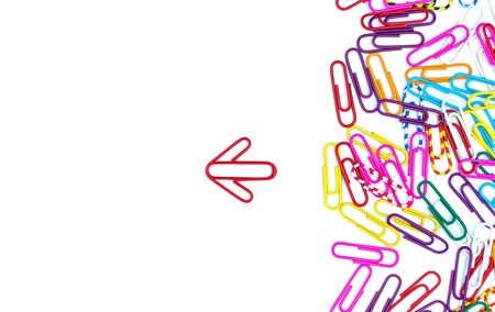 Think different concept for group of stacked paperclip with another one Red paper clip is point to another direction as a team leadership, Business and financeの写真素材