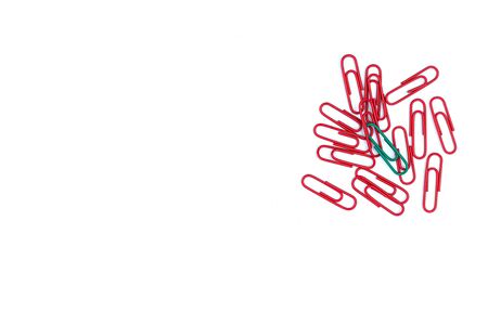 Think different concept for group of stacked Red paperclip with another one Green paper clip is point to another direction as a team leadership, Business and financeの写真素材
