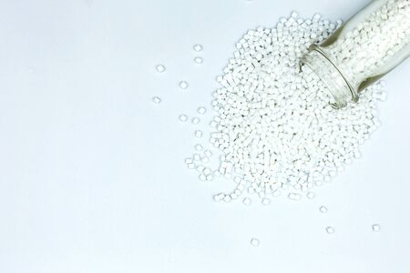 Top view close up White color Plastic beads on white background, Resin plastics for industrialの写真素材