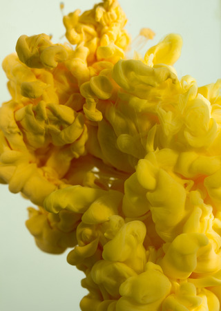 colorful ink drops in waterの写真素材
