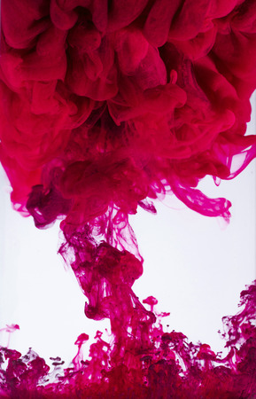 colorful ink drops in waterの写真素材