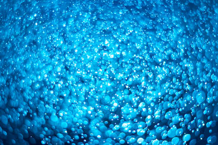 abstract deep blue background with blur bokeh light effect
