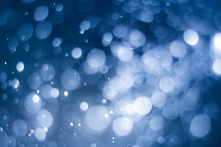 abstract blue sky background with blur bokeh light effectの写真素材