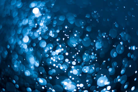 Dark blue bokeh backgroundの写真素材