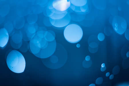 Dark blue bokeh backgroundの写真素材