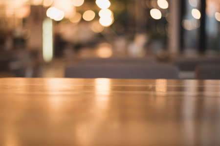 wooden table on light bokeh background in the restaurant
