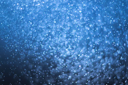 abstract dark deep blue background with soft blur bokeh light effect