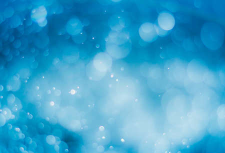 abstract gradient blue background with bokeh light effectの写真素材