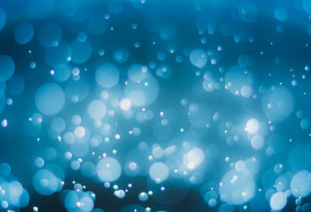 abstract gradient blue background with bokeh light effectの写真素材