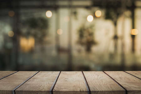 3D Rendering, Wooden table with bokeh light effect and blur restaurant on backgroundの写真素材