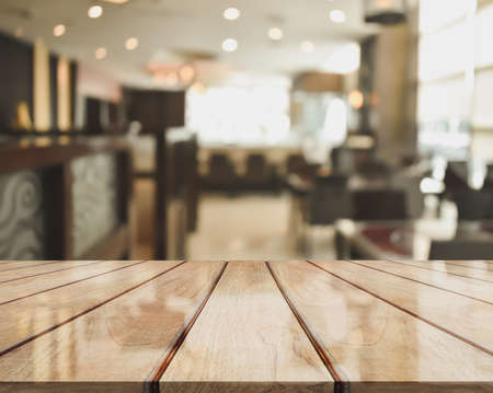 3D Rendering, Wooden top table with bokeh light effect and blur restaurant on background, blur backgroundの写真素材
