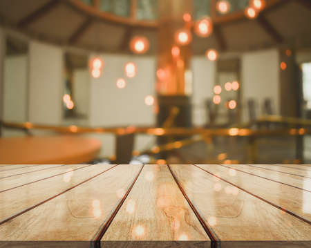 3D Rendering, Wooden top table with bokeh light effect and blur restaurant on background, blur backgroundの写真素材