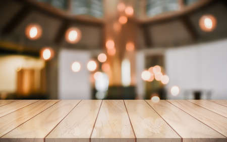 Empty wooden table top with lights bokeh on blur restaurant background, 3D Renderingの写真素材