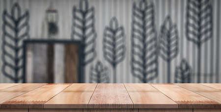 Empty wood table with blur vintage restaurant background.