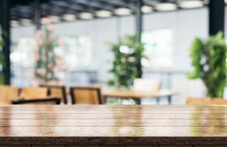 Empty white marble stone table top and blur interior cafe and restaurant.の写真素材