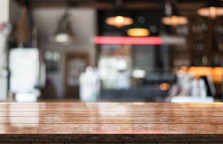 Empty white marble stone table top and blur interior cafe and restaurant.の写真素材