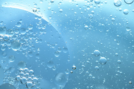 Water bubble texture on blue backgroundの写真素材